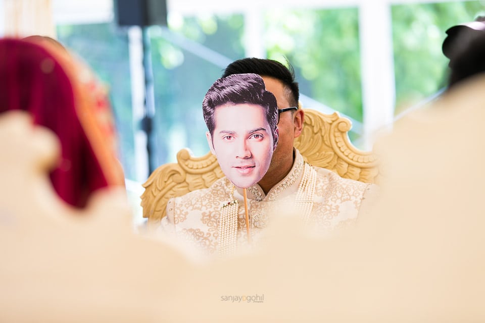 Groom with mask infront of his face