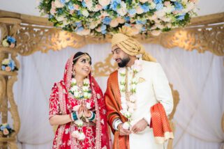 Bride and Groom smiling at each other