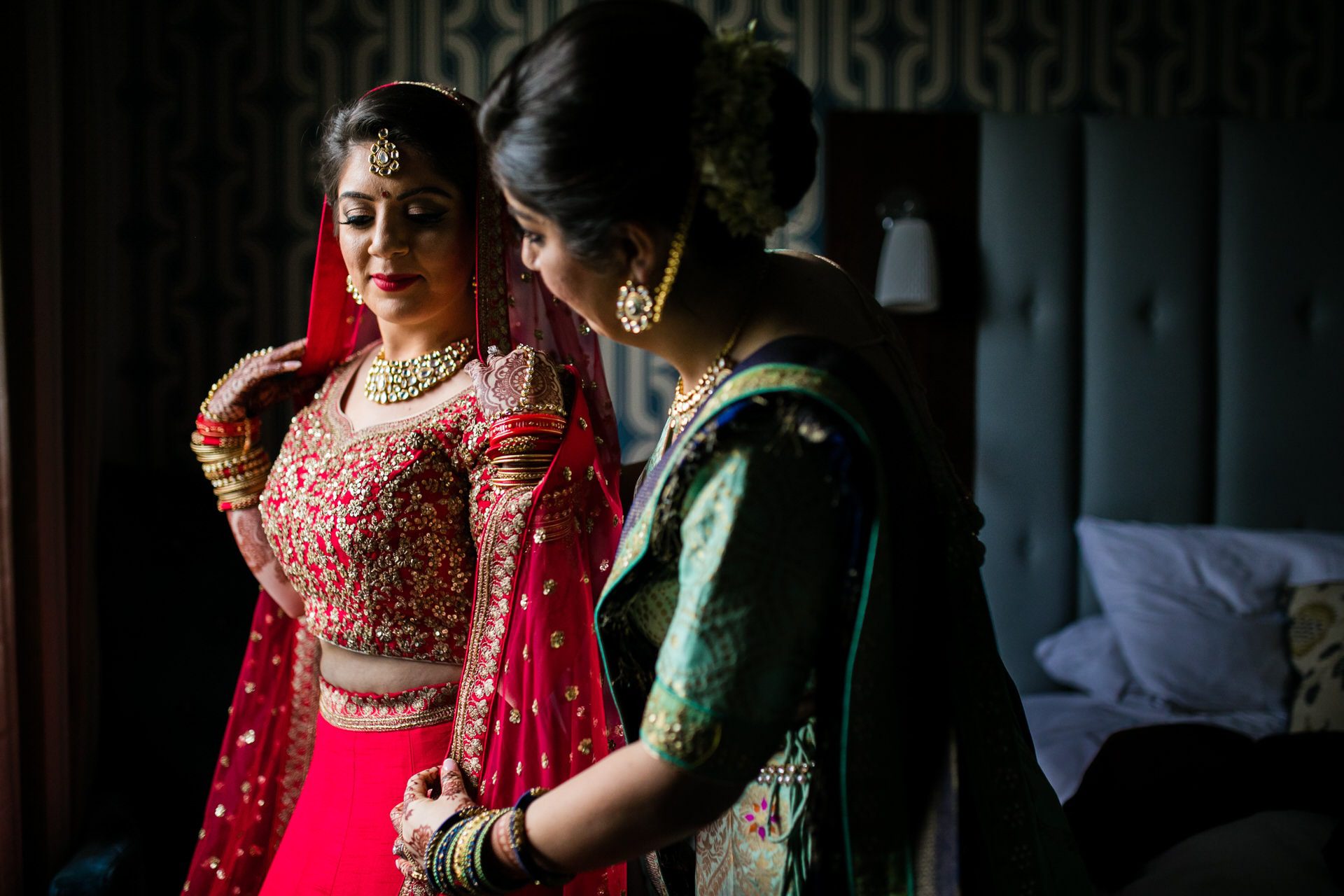 Bride of the sister helping bride get ready