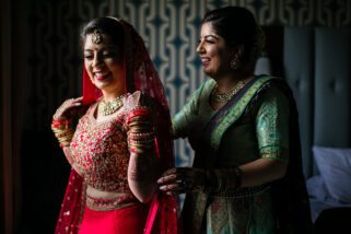 Bride of the sister helping bride get ready