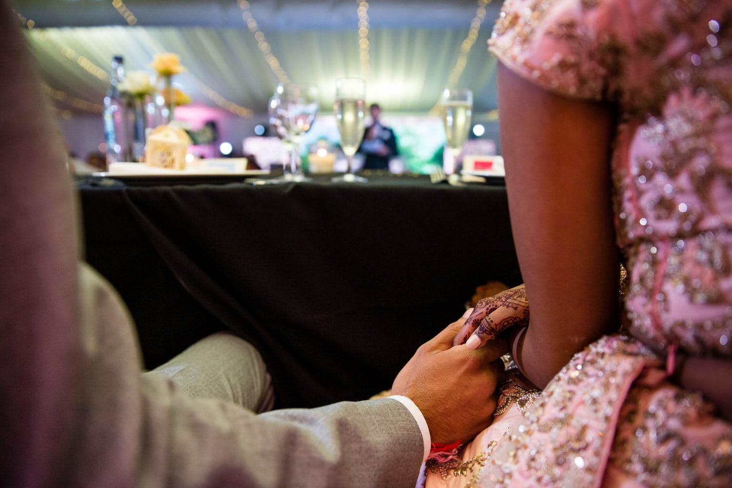 Bride and groom holding hands