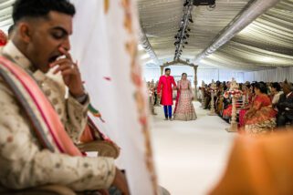 Bridal entrance with groom yawning