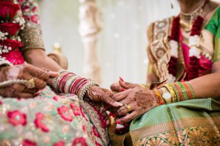 bride and mum holding hands