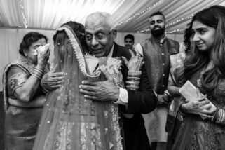 Bride hugging grand father during Vidhia